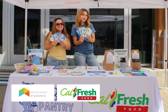 Informational tabling booth with CalFresh advertisements.